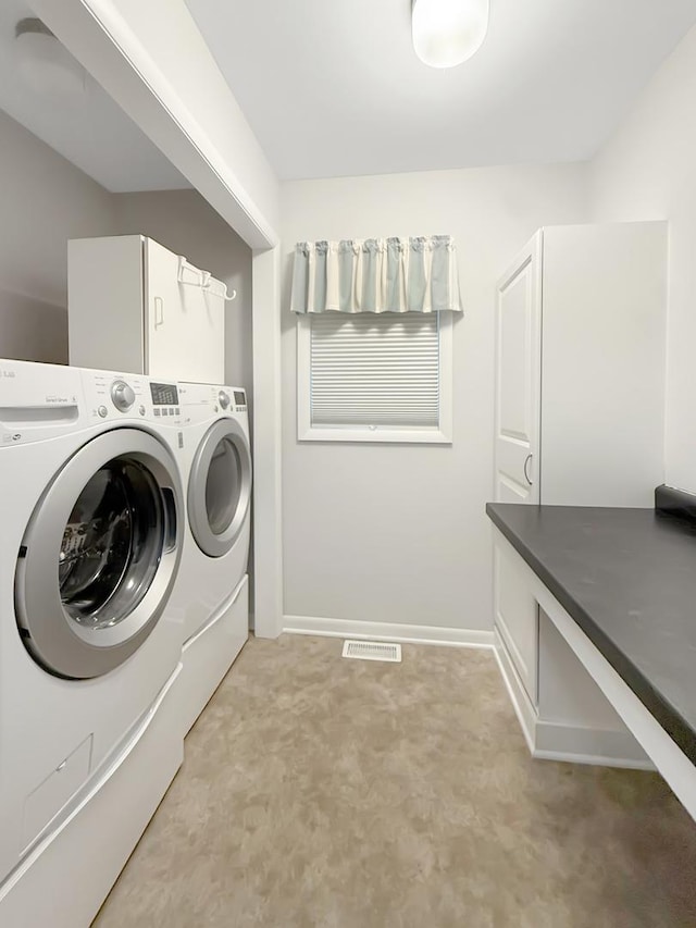 701 E Soper St, Winnebago, IL 61088 - washroom featuring washing machine and dryer and light carpet