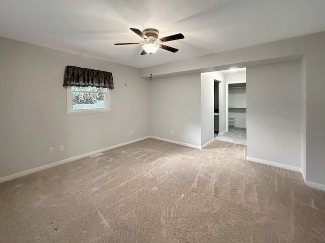 701 E Soper St, Winnebago, IL 61088 - empty room featuring ceiling fan and carpet floors