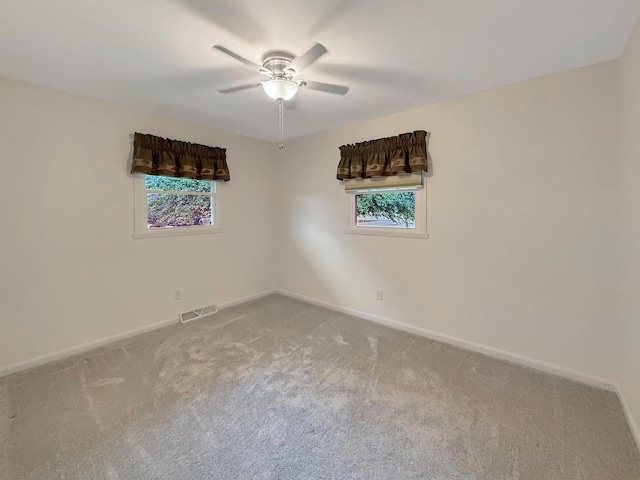 701 E Soper St, Winnebago, IL 61088 - carpeted spare room featuring baseboards and ceiling fan