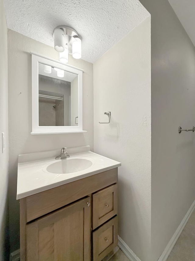 701 E Soper St, Winnebago, IL 61088 - bathroom featuring vanity and a textured ceiling