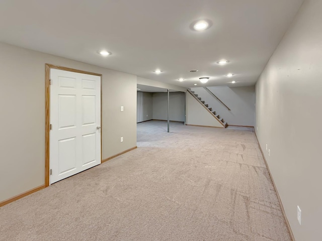 701 E Soper St, Winnebago, IL 61088 - finished basement with light colored carpet, recessed lighting, and stairway