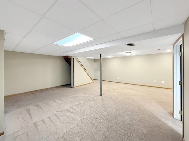 701 E Soper St, Winnebago, IL 61088 - finished below grade area with light colored carpet and a drop ceiling