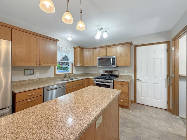 701 E Soper St, Winnebago, IL 61088 - kitchen with appliances with stainless steel finishes, pendant lighting, and light stone countertops