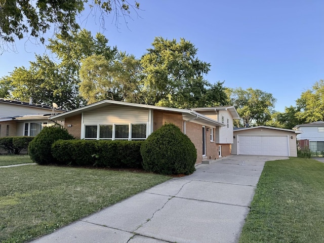 900 W Strieff Ln, Glenwood, IL 60425 - split level home featuring brick siding, an outdoor structure, a detached garage, and a front yard