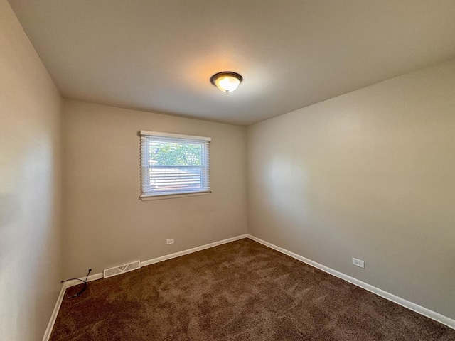 900 W Strieff Ln, Glenwood, IL 60425 - unfurnished room featuring baseboards and dark carpet