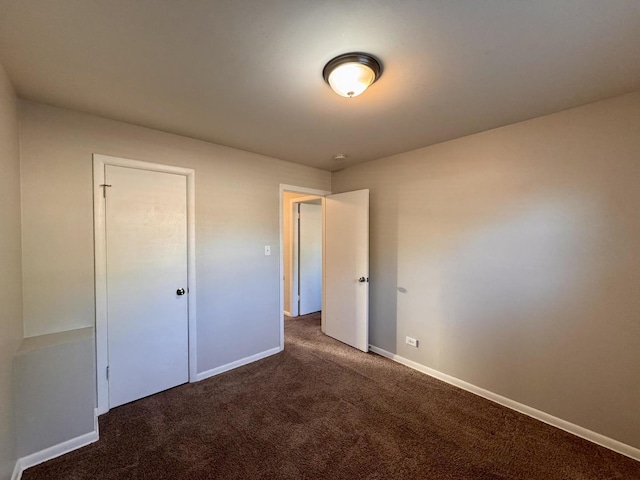 900 W Strieff Ln, Glenwood, IL 60425 - unfurnished bedroom featuring carpet flooring and baseboards