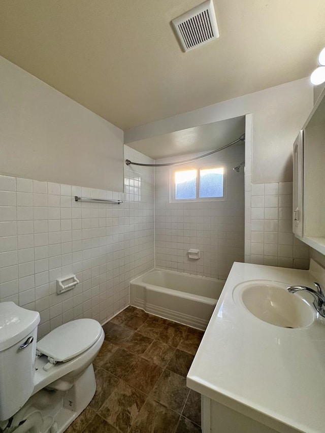 900 W Strieff Ln, Glenwood, IL 60425 - bathroom with tile walls, washtub / shower combination, vanity, and a wainscoted wall
