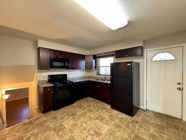900 W Strieff Ln, Glenwood, IL 60425 - kitchen featuring black appliances, dark brown cabinetry, and light stone countertops