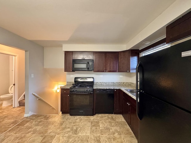 900 W Strieff Ln, Glenwood, IL 60425 - kitchen with black appliances, dark brown cabinets, and light stone counters