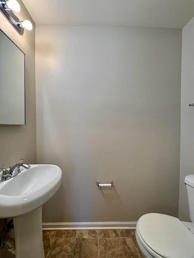 900 W Strieff Ln, Glenwood, IL 60425 - bathroom featuring toilet and baseboards