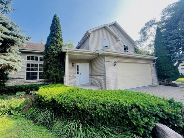 1858 David Ave, Joliet, IL 60433 - view of front of house featuring brick siding, driveway, and an attached garage