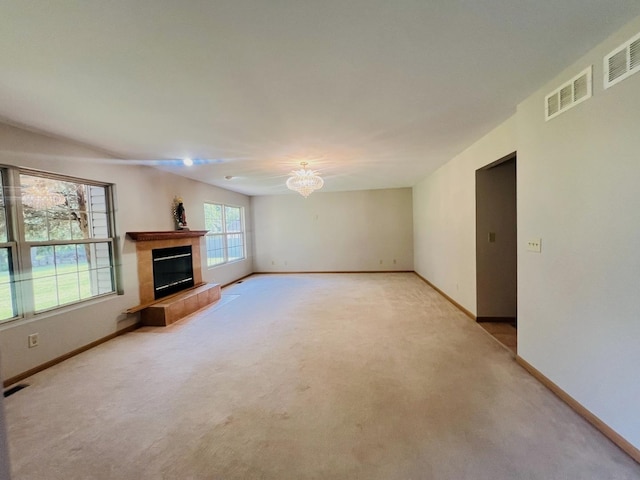 1858 David Ave, Joliet, IL 60433 - unfurnished living room featuring light carpet and a tile fireplace