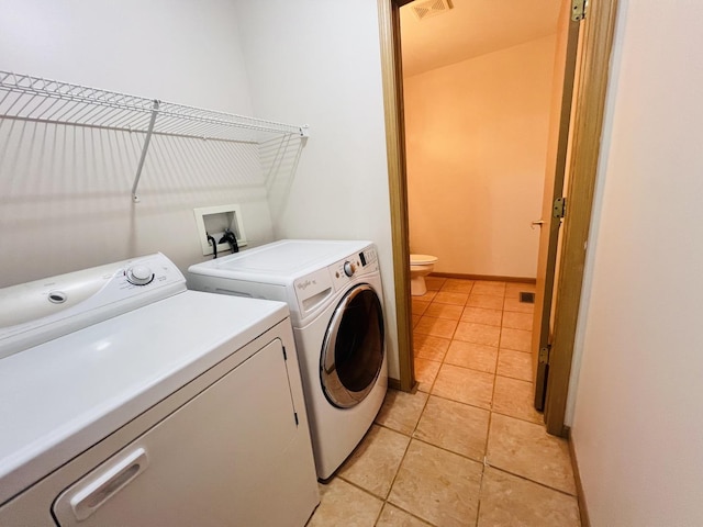 1858 David Ave, Joliet, IL 60433 - washroom featuring washer and dryer and light tile patterned floors