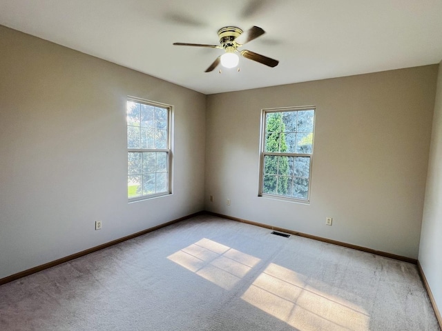 1858 David Ave, Joliet, IL 60433 - empty room with light carpet and ceiling fan