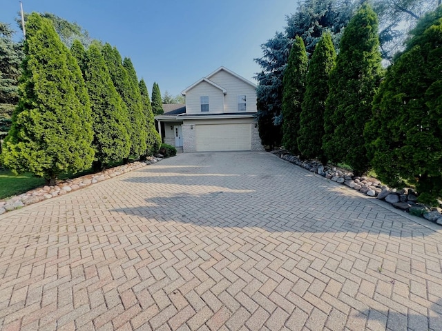 1858 David Ave, Joliet, IL 60433 - view of front of house with decorative driveway and a garage