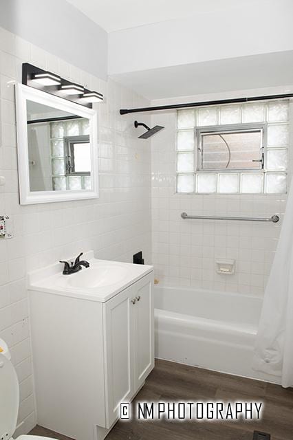 9828 Warren Ave, Oak Lawn, IL 60453 - bathroom with shower / bath combo with shower curtain, wood finished floors, vanity, and tile walls