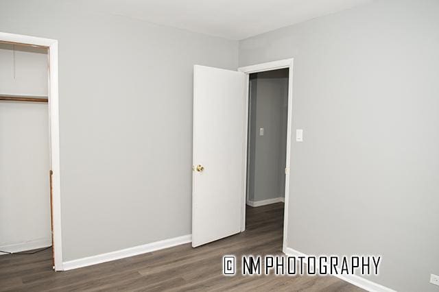 9828 Warren Ave, Oak Lawn, IL 60453 - unfurnished bedroom with wood finished floors and a closet