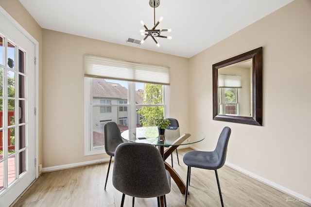 1530 Orchard Cir, Naperville, IL 60565 - dining space with light wood-style flooring and a chandelier