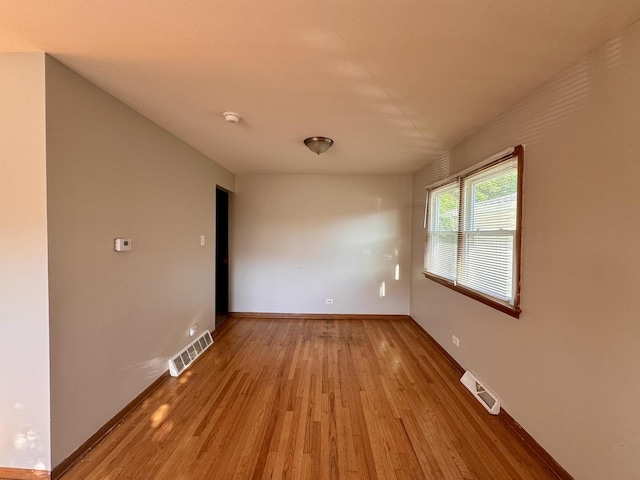 15542 S Park Ave, South Holland, IL 60473 - spare room with light wood-style flooring and a smoke detector