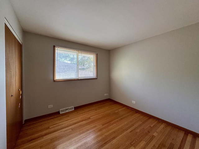 15542 S Park Ave, South Holland, IL 60473 - unfurnished bedroom featuring light wood-type flooring and a closet