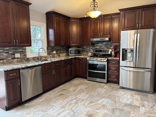16529 Edgewood Dr, Plainfield, IL 60586 - kitchen featuring appliances with stainless steel finishes, tasteful backsplash, under cabinet range hood, and stone counters