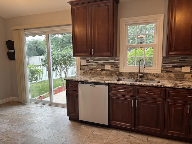 16529 Edgewood Dr, Plainfield, IL 60586 - kitchen with dishwasher, stone tile floors, tasteful backsplash, stone countertops, and dark brown cabinetry