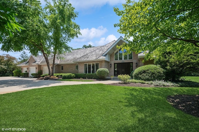 1881 Haven Ln, Green Oaks, IL 60048 - view of front of home with a garage, a front yard, brick siding, and concrete driveway