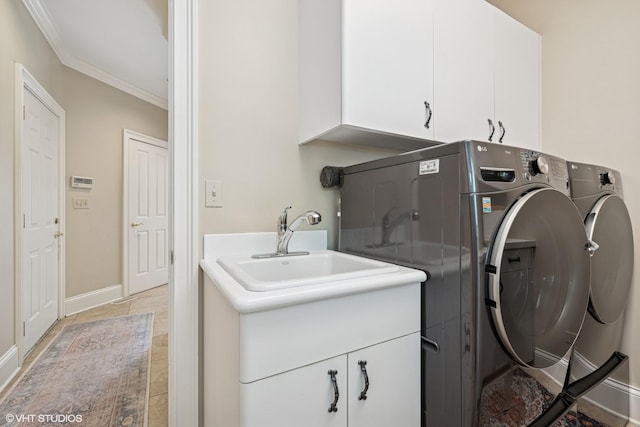 1881 Haven Ln, Green Oaks, IL 60048 - laundry room featuring cabinet space, separate washer and dryer, and ornamental molding