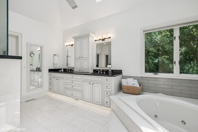 1881 Haven Ln, Green Oaks, IL 60048 - full bath with double vanity, a whirlpool tub, tile patterned flooring, and high vaulted ceiling