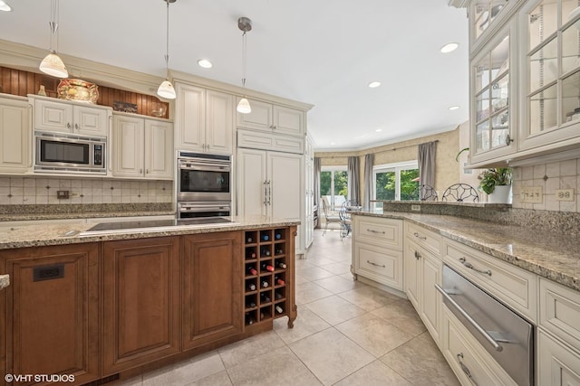 1881 Haven Ln, Green Oaks, IL 60048 - kitchen featuring stainless steel appliances, a warming drawer, backsplash, light stone counters, and recessed lighting