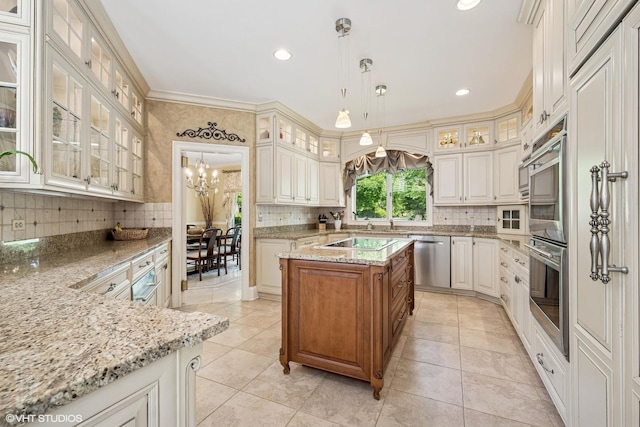 1881 Haven Ln, Green Oaks, IL 60048 - kitchen with appliances with stainless steel finishes, decorative backsplash, a chandelier, light stone counters, and recessed lighting