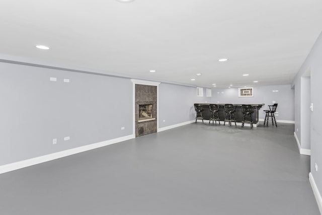9613 S Kostner Ave, Oak Lawn, IL 60453 - living area with wet bar, finished concrete floors, recessed lighting, and a tiled fireplace
