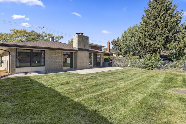 9613 S Kostner Ave, Oak Lawn, IL 60453 - back of house featuring brick siding, a patio area, a chimney, and a shingled roof