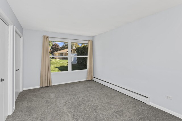9613 S Kostner Ave, Oak Lawn, IL 60453 - unfurnished bedroom with baseboard heating and carpet floors