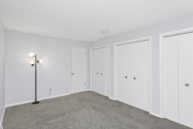 9613 S Kostner Ave, Oak Lawn, IL 60453 - unfurnished bedroom featuring multiple closets and carpet flooring