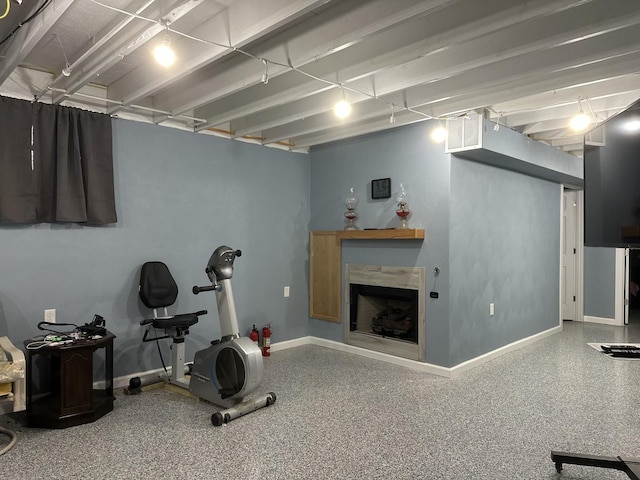 1959 W Navajo Dr, Freeport, IL 61032 - workout room featuring a tiled fireplace and baseboards