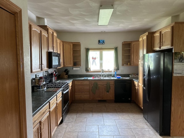 1959 W Navajo Dr, Freeport, IL 61032 - kitchen with black appliances, open shelves, dark countertops, and brown cabinets