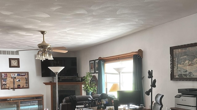 1959 W Navajo Dr, Freeport, IL 61032 - living room featuring ceiling fan and a fireplace