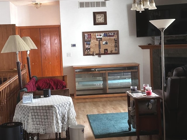 1959 W Navajo Dr, Freeport, IL 61032 - living area with wood finished floors, a chandelier, and a fireplace