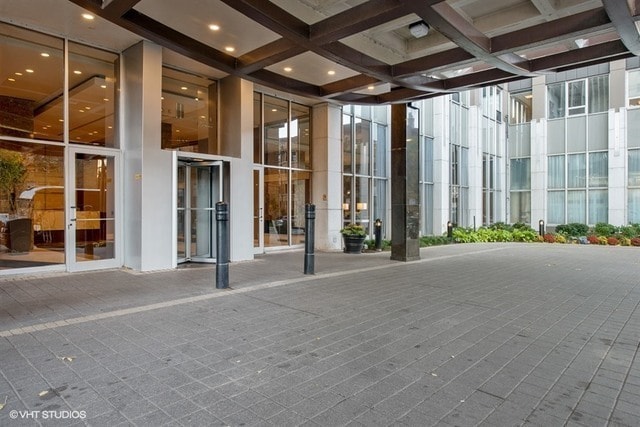 655 W Irving Park Rd Unit 5504, Chicago, IL 60613 - unfurnished sunroom with coffered ceiling and beam ceiling