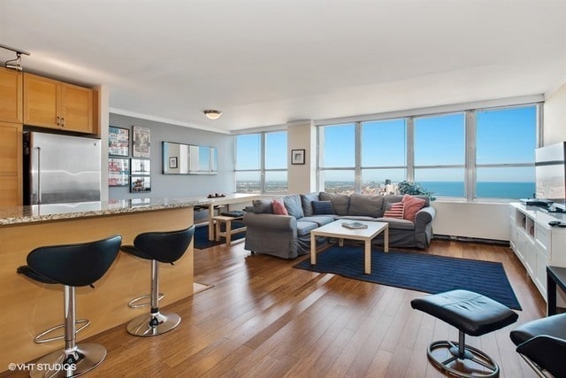 655 W Irving Park Rd Unit 5504, Chicago, IL 60613 - living room featuring wood finished floors