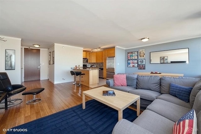 655 W Irving Park Rd Unit 5504, Chicago, IL 60613 - living area featuring light wood-style floors and ornamental molding