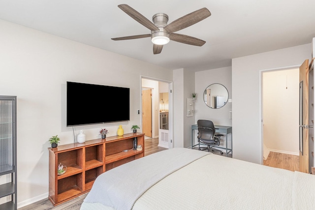 8306 Portsmouth Dr Unit 22B, Darien, IL 60561 - bedroom with light wood finished floors, a desk, and a ceiling fan