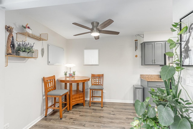8306 Portsmouth Dr Unit 22B, Darien, IL 60561 - dining area featuring light wood-style floors and ceiling fan