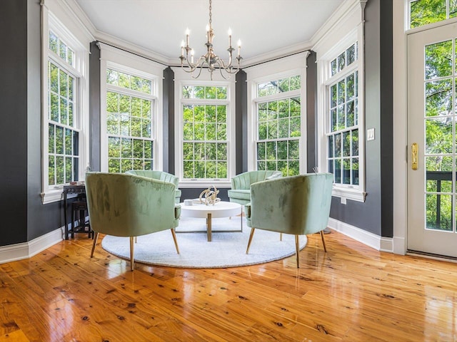 2207 N Elmkirk Pkwy N, Mchenry, IL 60051 - living area featuring a chandelier, crown molding, healthy amount of natural light, and wood finished floors