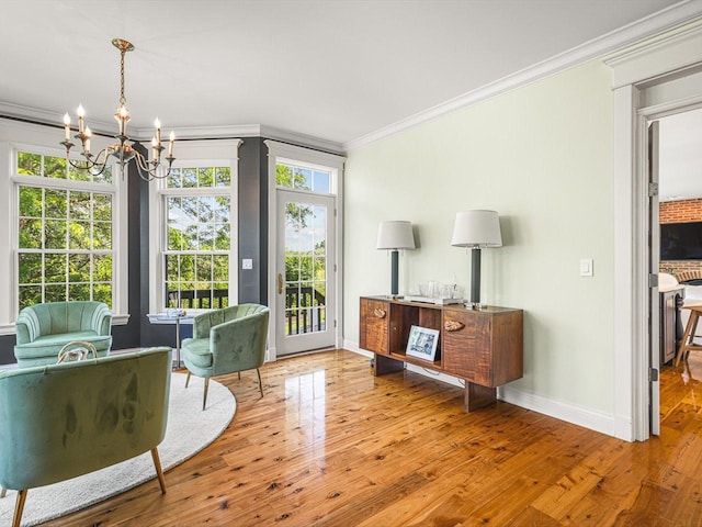 2207 N Elmkirk Pkwy N, Mchenry, IL 60051 - living area with ornamental molding, a chandelier, and hardwood / wood-style floors