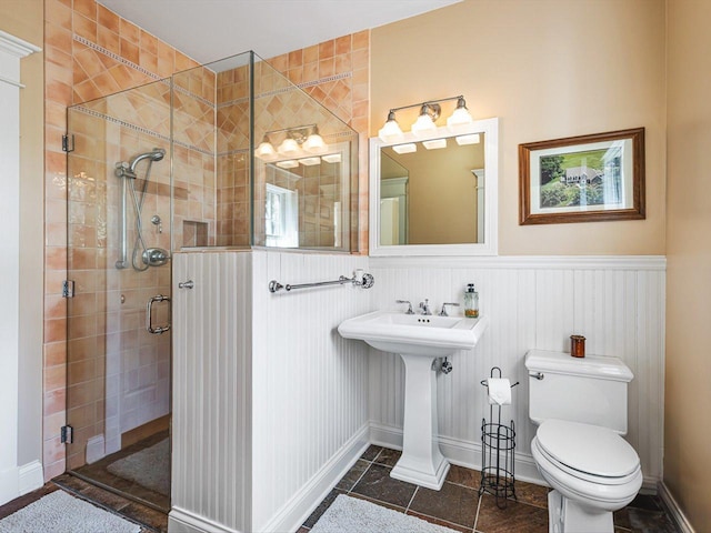 2207 N Elmkirk Pkwy N, Mchenry, IL 60051 - bathroom featuring a stall shower, wainscoting, and tile patterned flooring