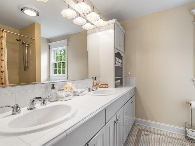2207 N Elmkirk Pkwy N, Mchenry, IL 60051 - bathroom with double vanity, a tile shower, and tile patterned flooring