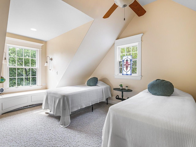 2207 N Elmkirk Pkwy N, Mchenry, IL 60051 - bedroom featuring multiple windows, light carpet, vaulted ceiling, and a ceiling fan