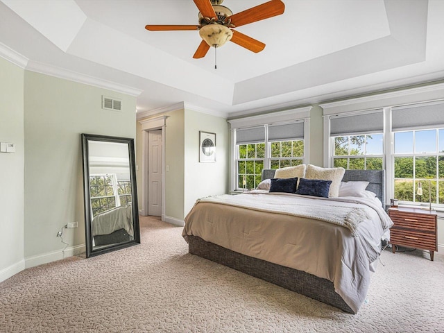 2207 N Elmkirk Pkwy N, Mchenry, IL 60051 - bedroom featuring a tray ceiling, light colored carpet, ornamental molding, and a ceiling fan